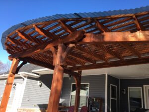 Wood pergola covered with corrugated polycarbonate